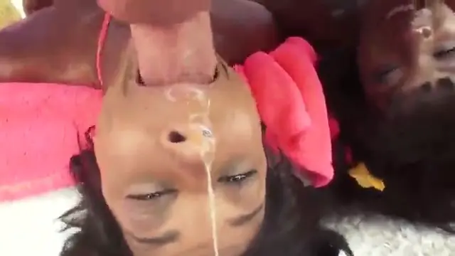 Two black women give Mike Adriano a blowjob