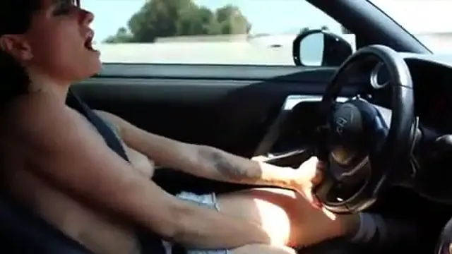 Tattooed naughty woman masturbates while driving