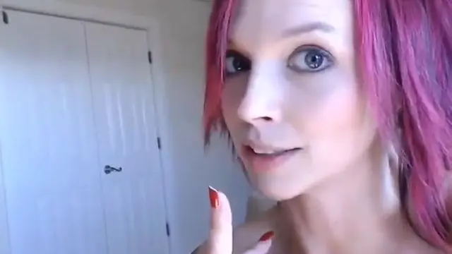 Anna Bell Peaks alone in her room