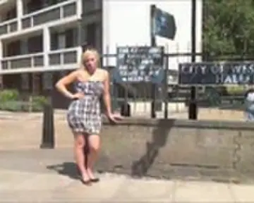 Blonde stripping off in the streets of London