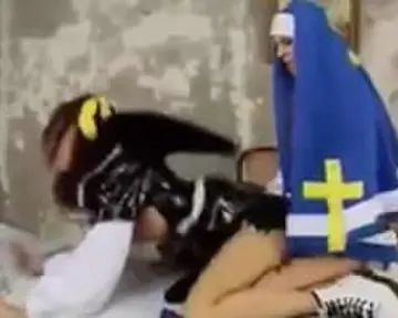 A cosplay nun with a cock satisfies an angel