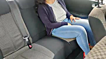 Woman pleasures herself in car, solo sex act