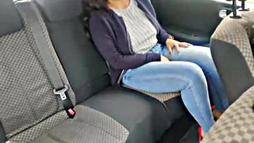 Woman pleasures herself in car, solo sex act