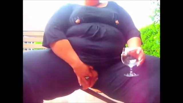 Very big lady pissing on a glasses outdoor