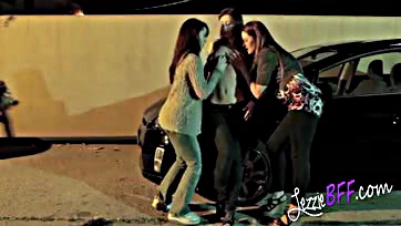 Lady friends get intimate in a public parking lot