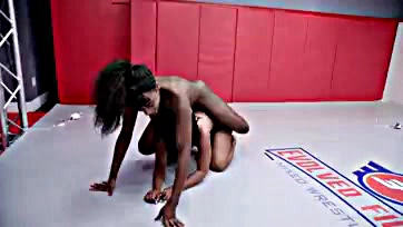 Two women engage in a strap-on sex fight