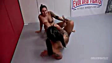 Lesbians engage in rough wrestling and explicit pussy play