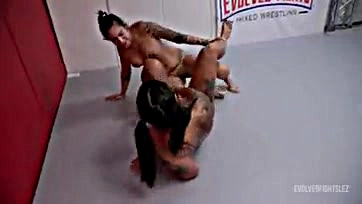 Lesbians engage in rough wrestling and explicit pussy play