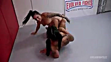 Lesbians engage in rough wrestling and explicit pussy play