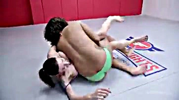 Lesbians engage in explicit wrestling and sexual activities