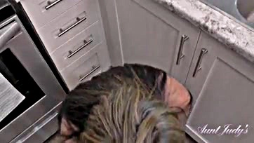 MILF sucks cock in kitchen, big booty involved