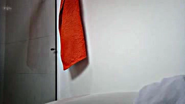 Natural Latina's tits exposed in bathroom video