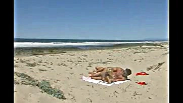 Man has sex with woman on beach