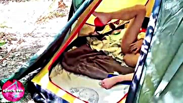 Teen girl wanks solo in tent, caught on camera