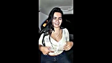 Hot Latina flaunts massive tits in car