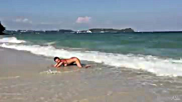 Teen blonde touches her ocean-side vulva