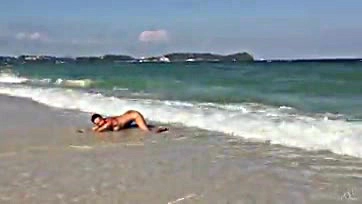 Teen blonde touches her ocean-side vulva