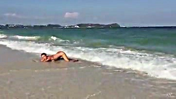 Teen blonde touches her ocean-side vulva