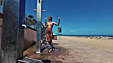 Sasha gets naked at public beach shower in Spain