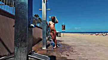 Sasha gets naked at public beach shower in Spain