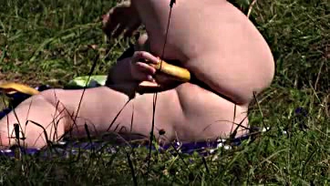 Mature milf masturbates outdoors with a banana