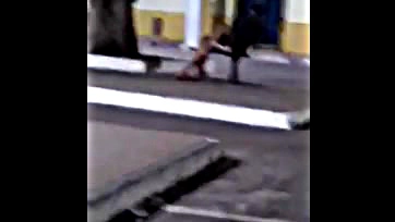 Naughty girl sucks cock in city square