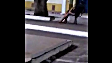 Naughty girl sucks cock in city square