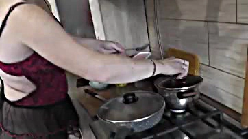 MILF cooks nude, shows all in kitchen