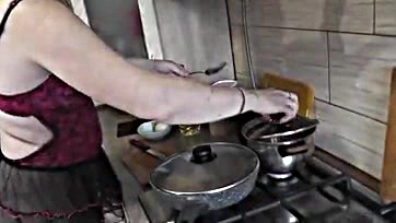 MILF cooks nude, shows all in kitchen