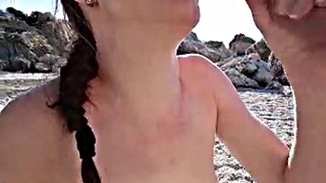 Brunette blows stranger, swallows cum on wild beach