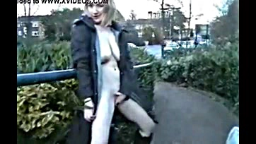 A mature woman publicly exposes herself outdoors