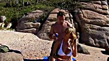 Blonde milf gets threesome on public beach