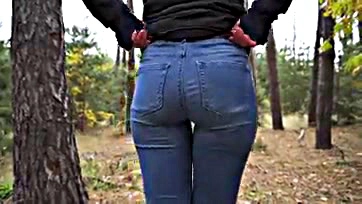 Teen girl teases her tight ass in woods