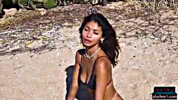 Teen Latina flaunts bare tits and ass on beach