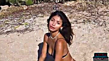 Teen Latina flaunts bare tits and ass on beach