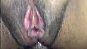 A woman's vulva is pierced in the anus