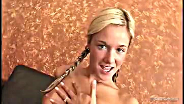 Blonde's hair swings while she rides a cock