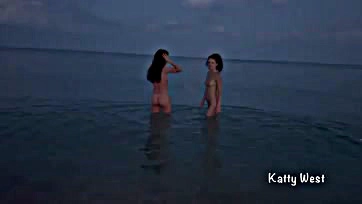 Naked women frolic in public beach