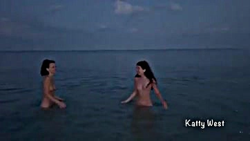 Naked women frolic in public beach