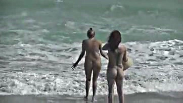 Wife spreads legs, teases cocks on nude beach