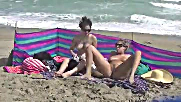 Wife spreads legs, teases cocks on nude beach