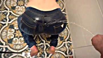 Dude's desperate pee stains his jeans and ass