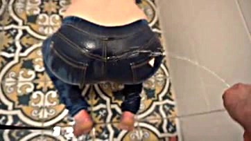 Dude's desperate pee stains his jeans and ass