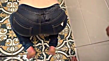 Dude's desperate pee stains his jeans and ass