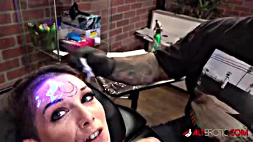 Fucked up chick inks weird tat on forehead