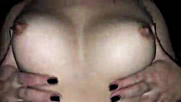 Sexy woman fondling breasts and genitals