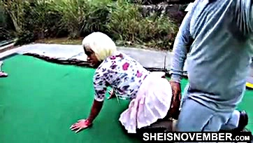 Black woman has sex at mini golf course