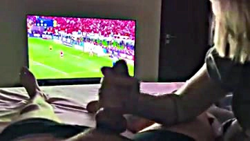 Newlywed wife sucks husband's cock during football match