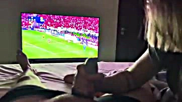 Newlywed wife sucks husband's cock during football match