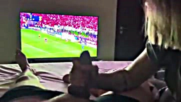 Newlywed wife sucks husband's cock during football match